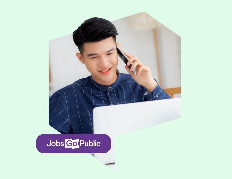 Mint green background with graphic of a man speaking on the phone while seated at his laptop