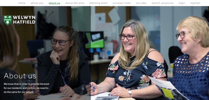 Welwyn Hatfield careers about us page. Subtitle: We know that in order to provide the best for our residents and visitors, we need to do the same for our people. Background image shows 3 female employees smiling at a meeting table.
