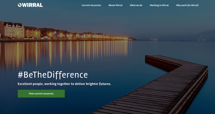 Wirral Council careers site header. Background image is a small pier overlooking a harbour at night. Text: #BeTheDifference: Excellent people, working together to deliver brighter futures.